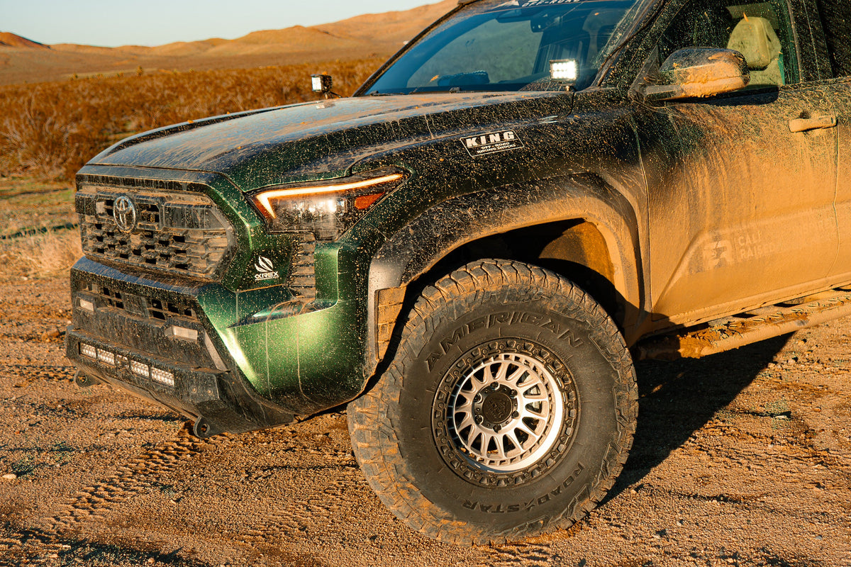 Green 4th Gen Toyota Tacoma on Lock Off-Road Mojave wheels, front three-quarter view