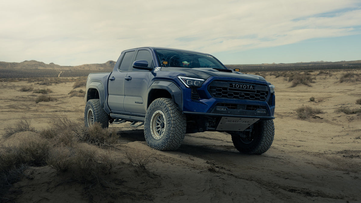 Blue 4th Gen Toyota Tacoma on Lock Off-Road Krawler beadlock wheels (photo 1)