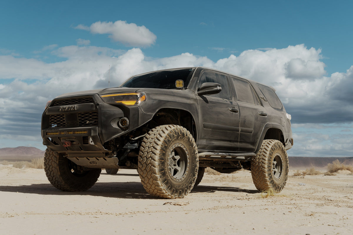 Charcoal 5th Gen Toyota 4Runner on Lock Off-Road Olympus wheels, front three-quarter view