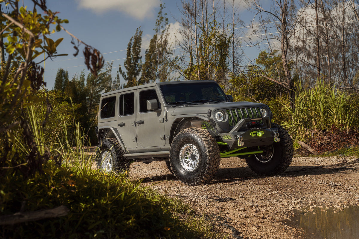 Grey Jeep Wrangler on Lock Off-Road Combat wheels, front three-quarter view