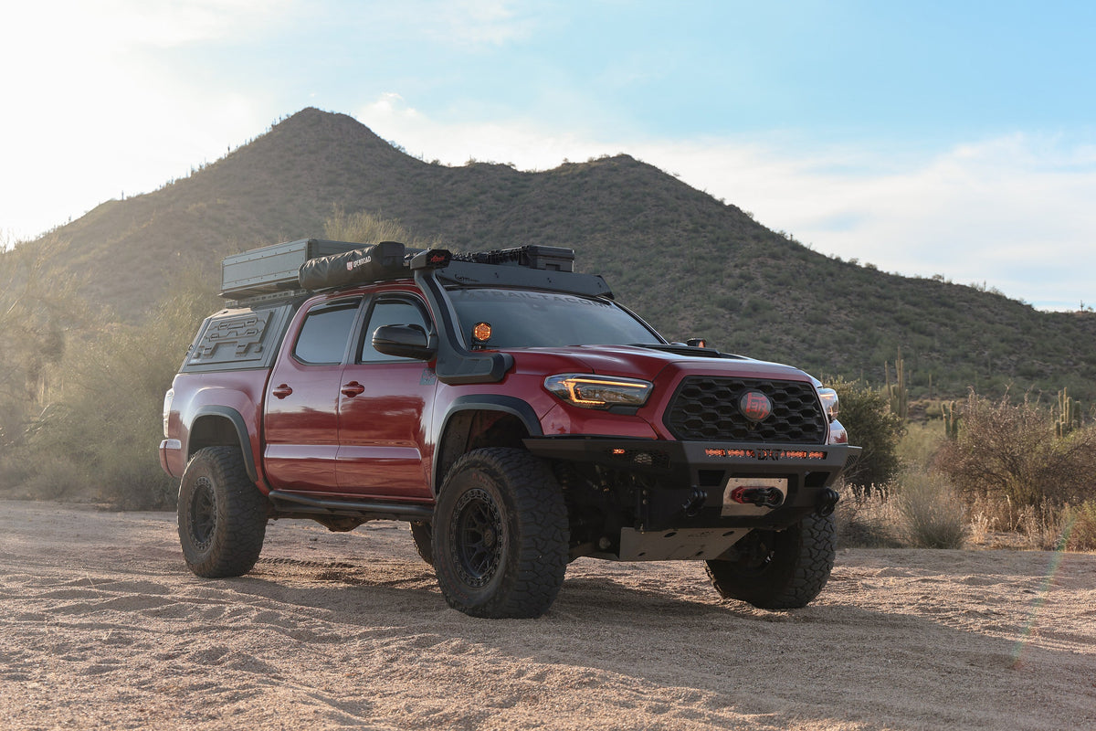 Red 3rd Gen Toyota Tacoma on Lock Off-Road Commando wheels in Matte Black, front three-quarter view